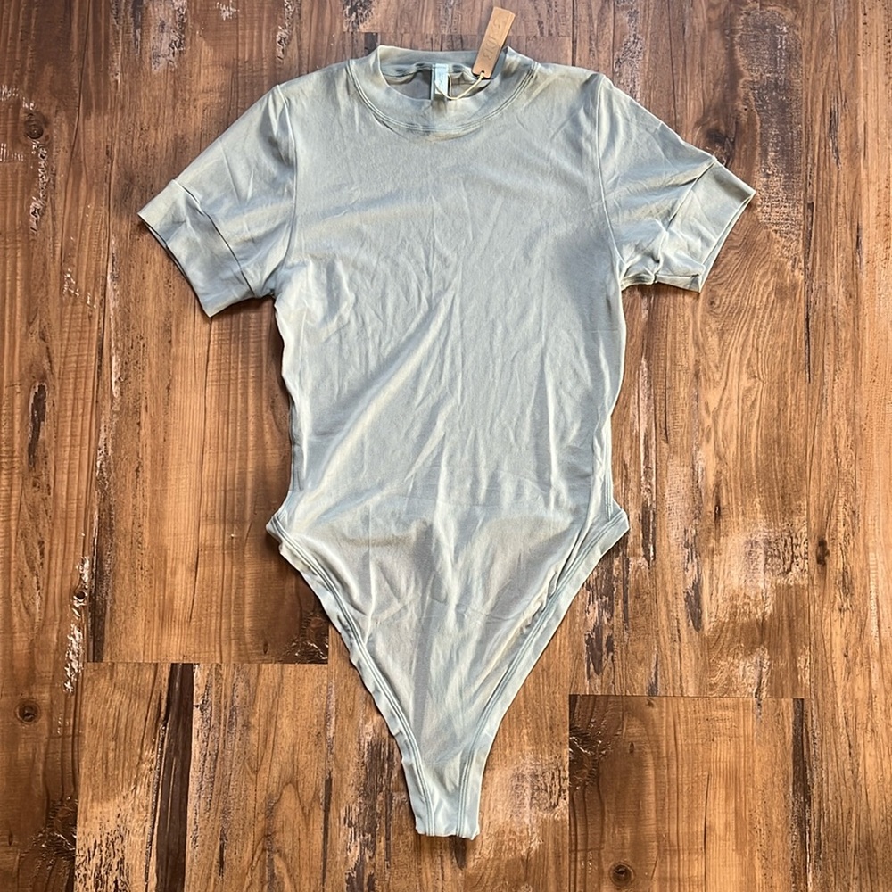 SKIMS Shortsleeved Sheer Thong Bodysuit in Sky Blue